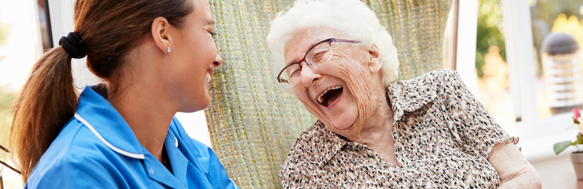 Caregiver and client laughing